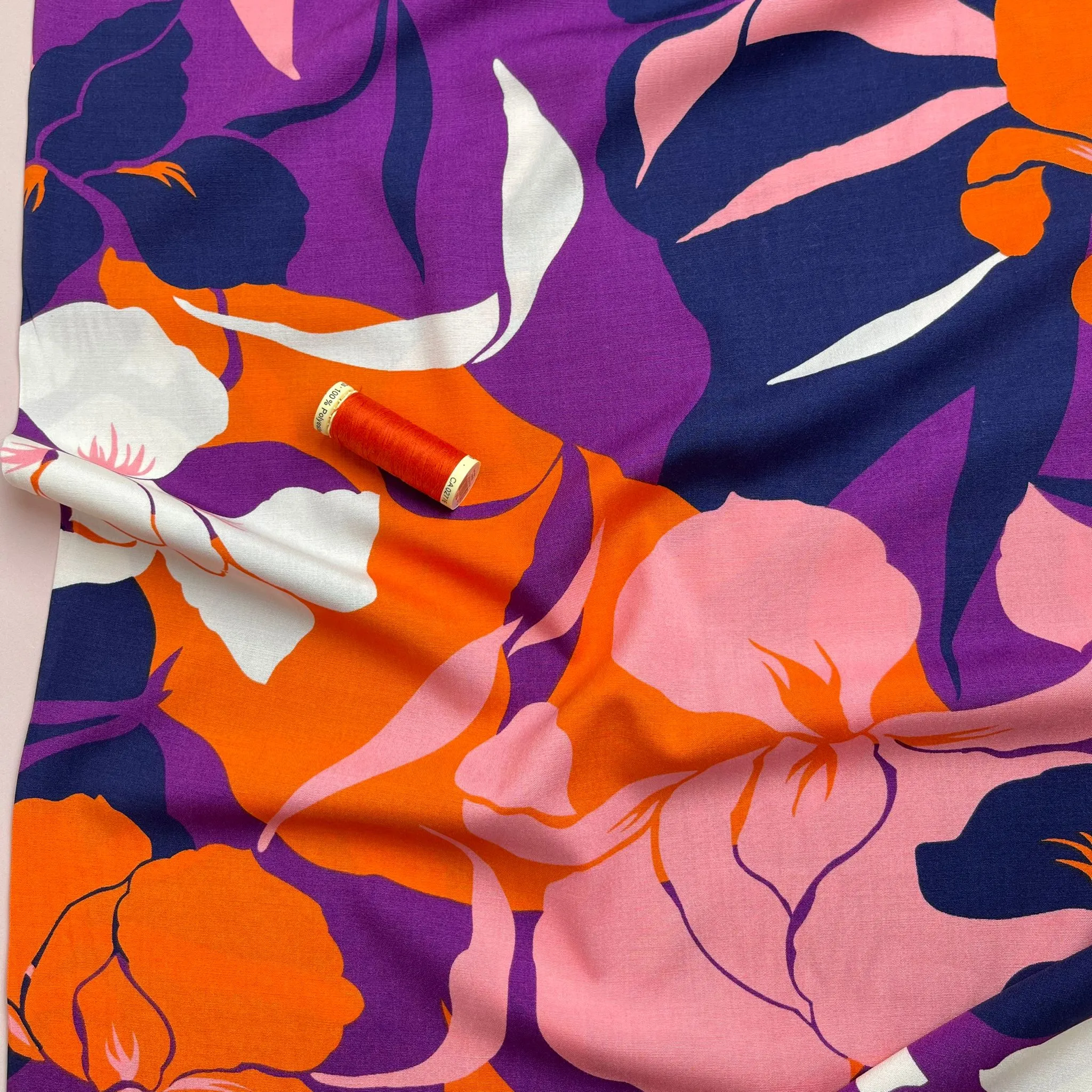 Bold Blooms on Purple Stretch Viscose Poplin Fabric