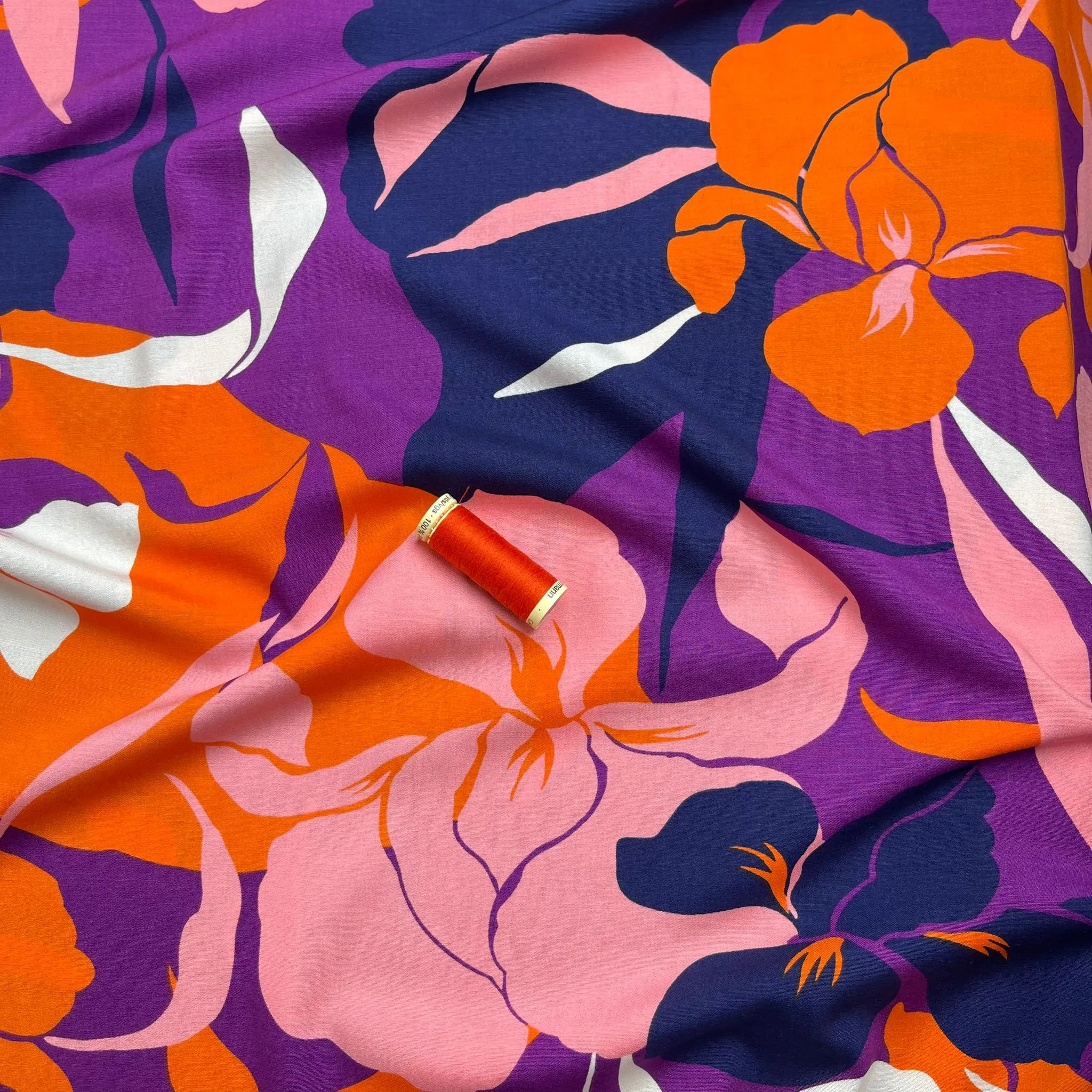 Bold Blooms on Purple Stretch Viscose Poplin Fabric