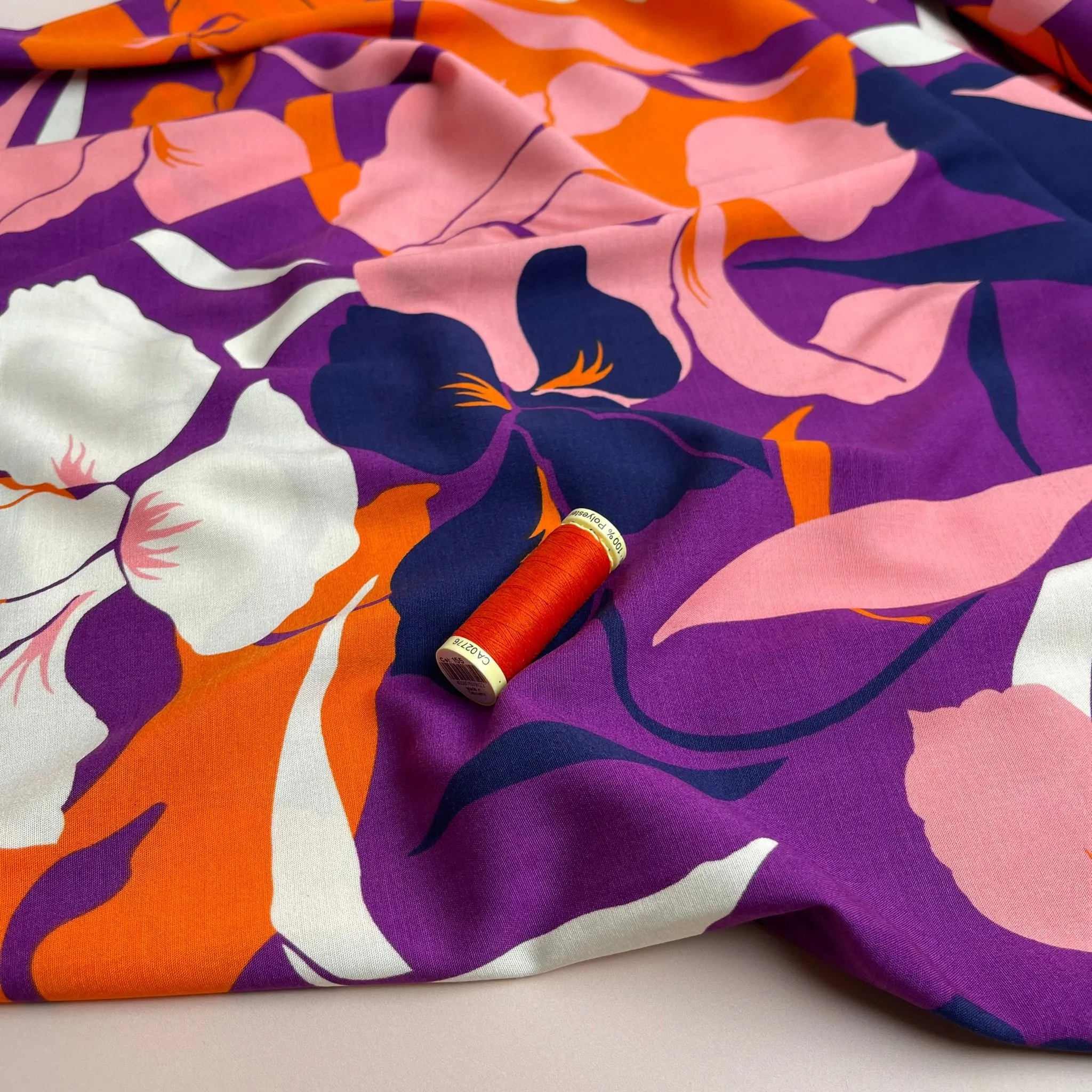 Bold Blooms on Purple Stretch Viscose Poplin Fabric