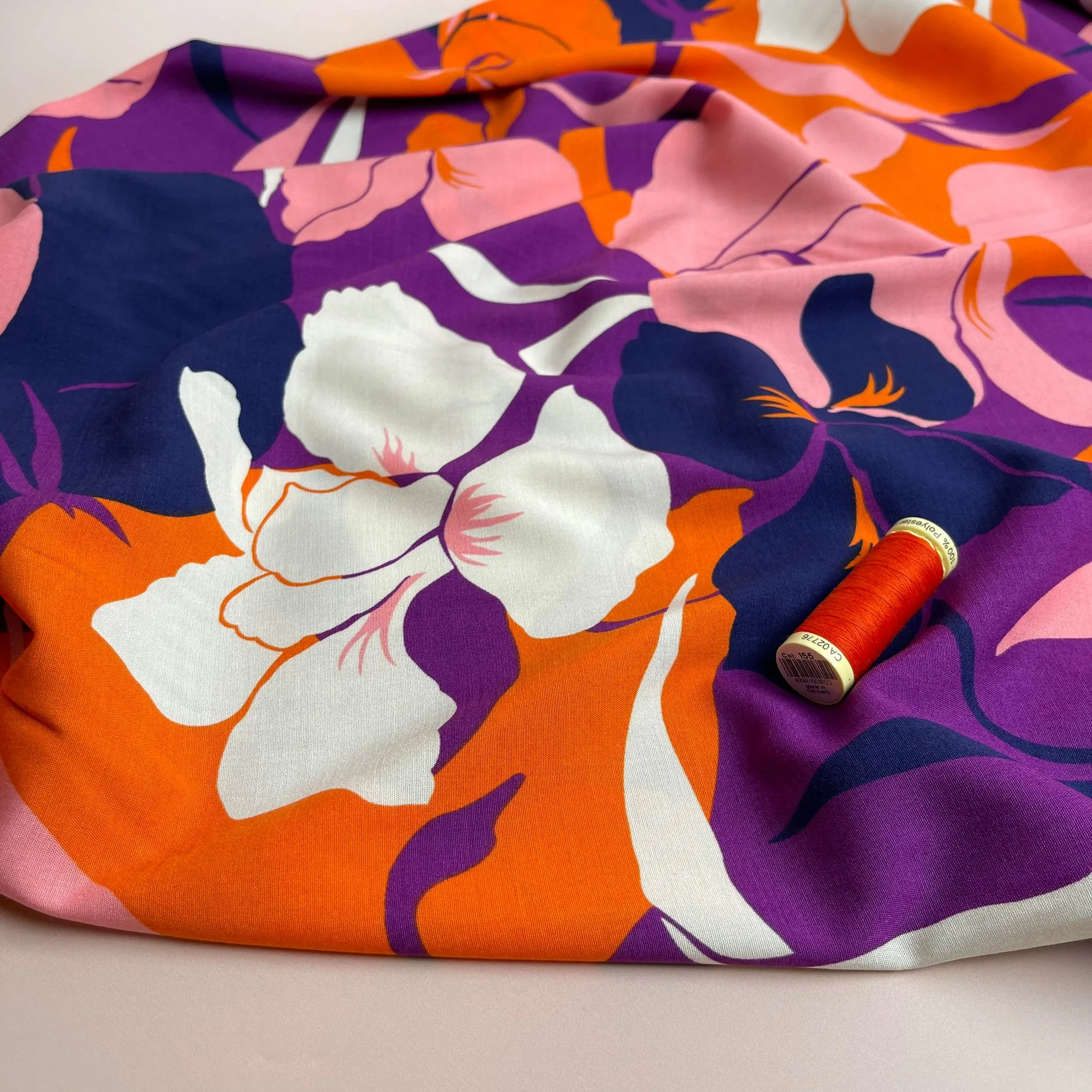 Bold Blooms on Purple Stretch Viscose Poplin Fabric